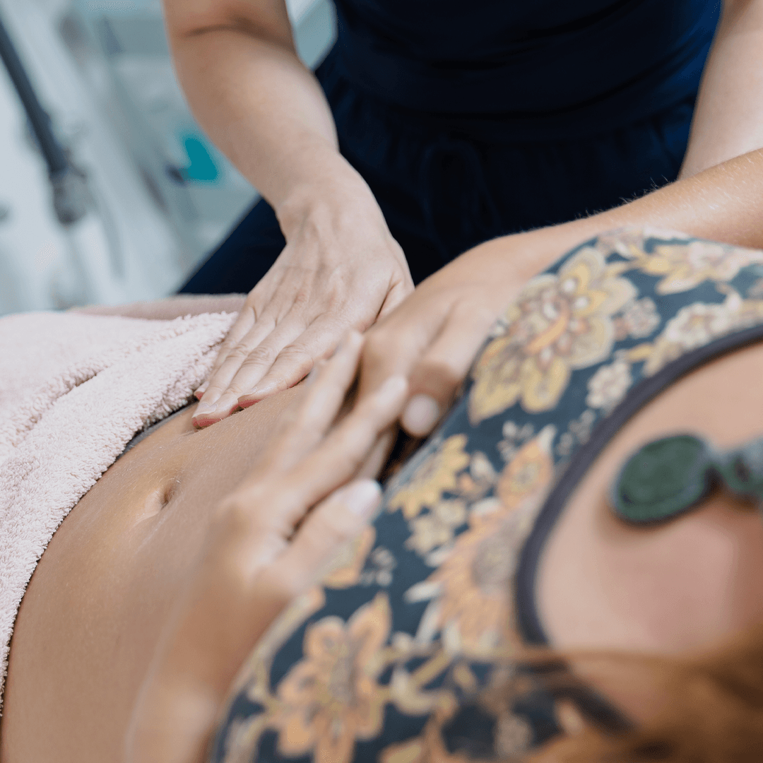 Gentle abdominal massage during a colon hydrotherapy session
